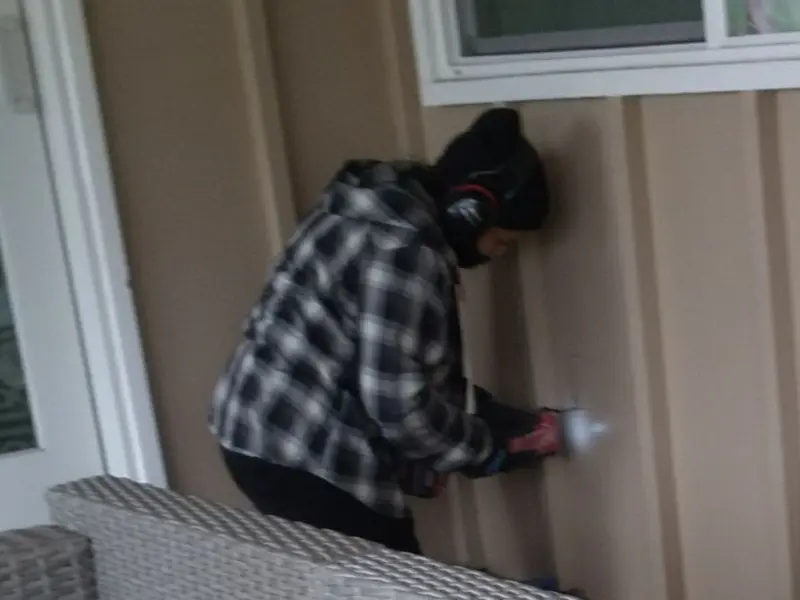 Professional electrician installing an exterior outlet in Alamo